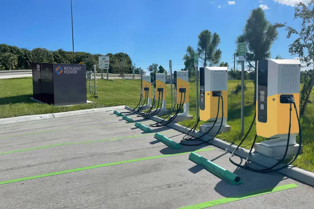 Resilient Power transformer station next to EV chargers in parking lot